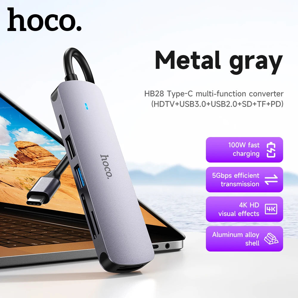 Hoco metal gray multi-function converter with features listed on a scenic background