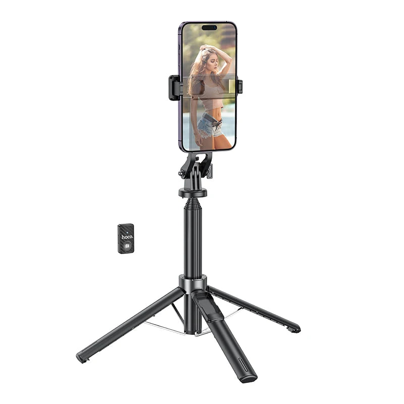 Black smartphone tripod stand with remote control on a white background
