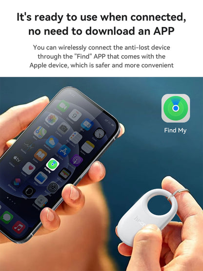 Person holding a smartphone with an anti-lost device and 'Find My' app icon displayed.