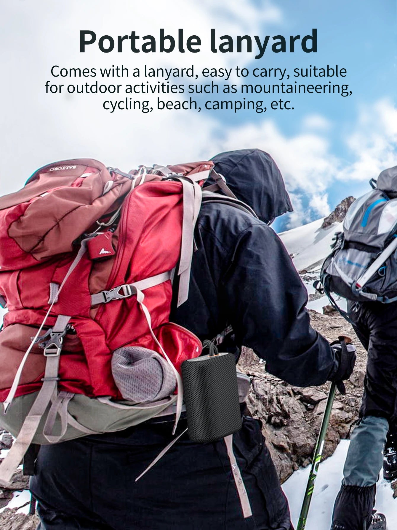 Person with a red backpack and portable device holder on a mountainous landscape