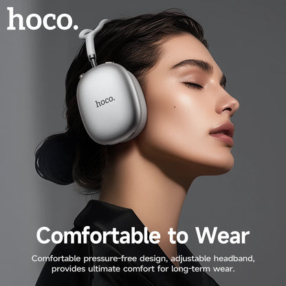 Person wearing hoco headphones with text highlighting comfort and design features.