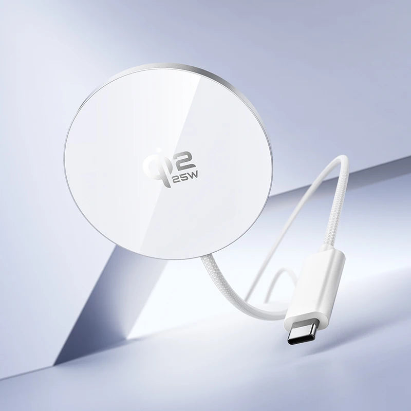 White round charging pad with cable on a light gray background