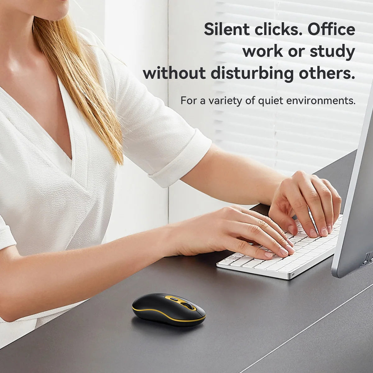 Person using a laptop with a mouse and keyboard on a desk, text about silent clicks.