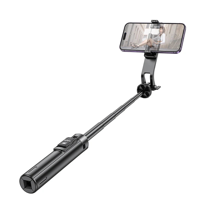 Black selfie stick with smartphone holder on a white background