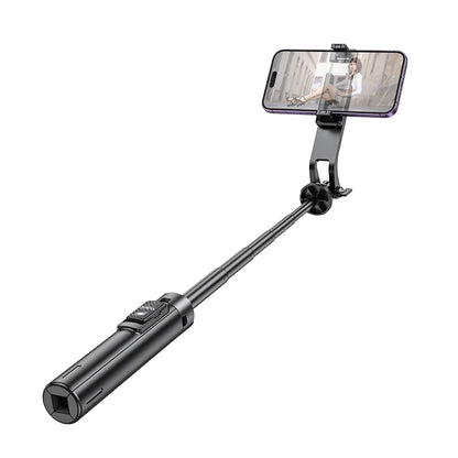 Black selfie stick with smartphone holder on a white background