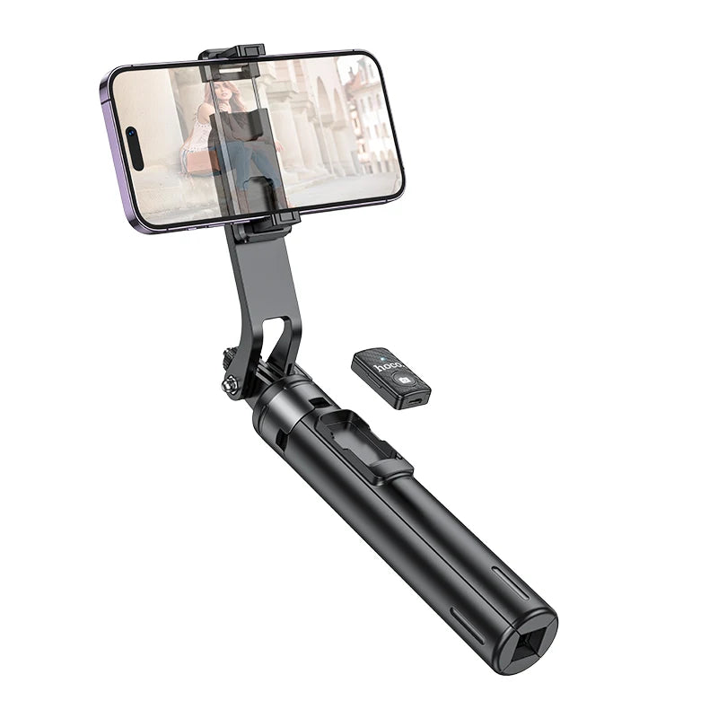 Black smartphone holder with remote control on a white background