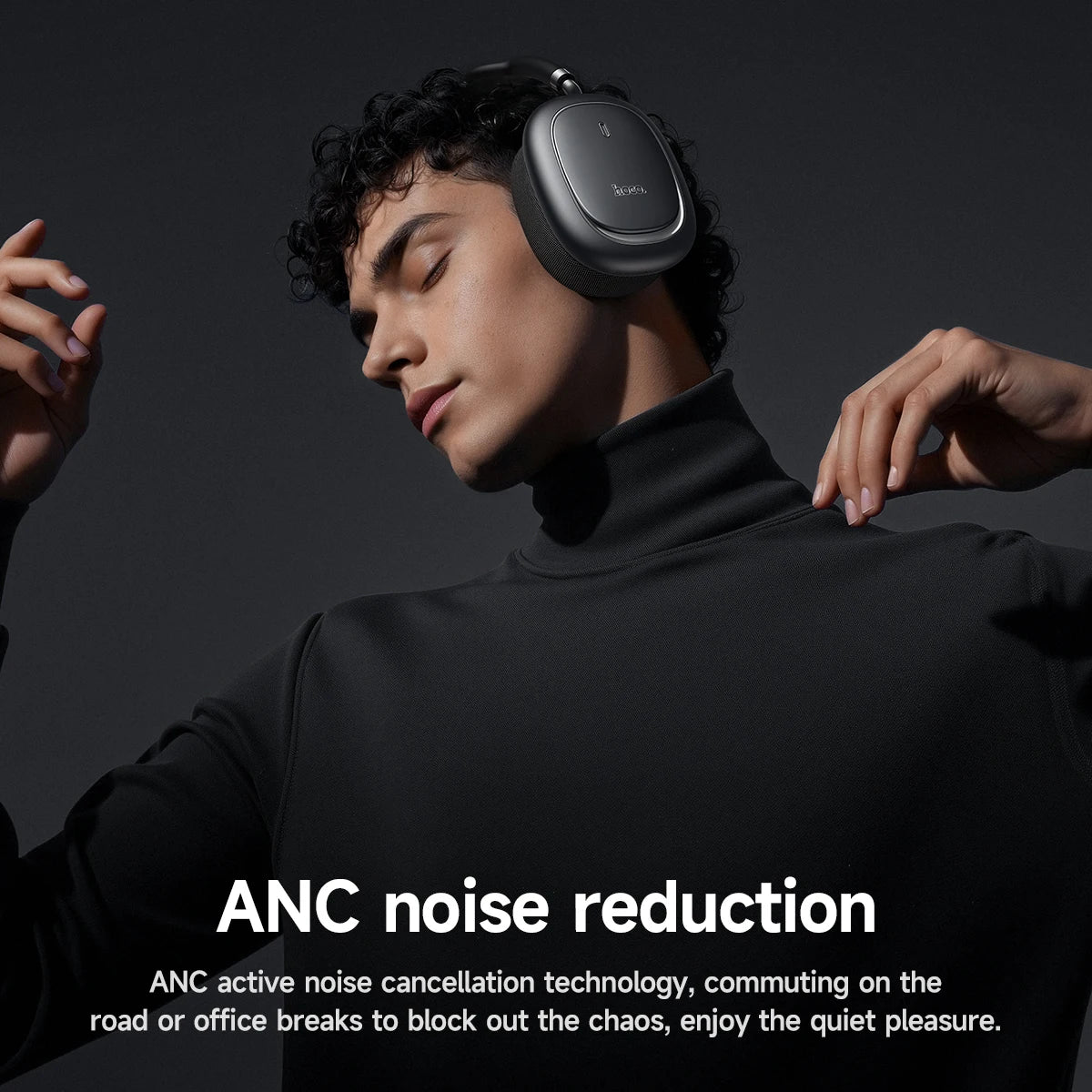 Person wearing headphones with ANC noise reduction text on a dark background